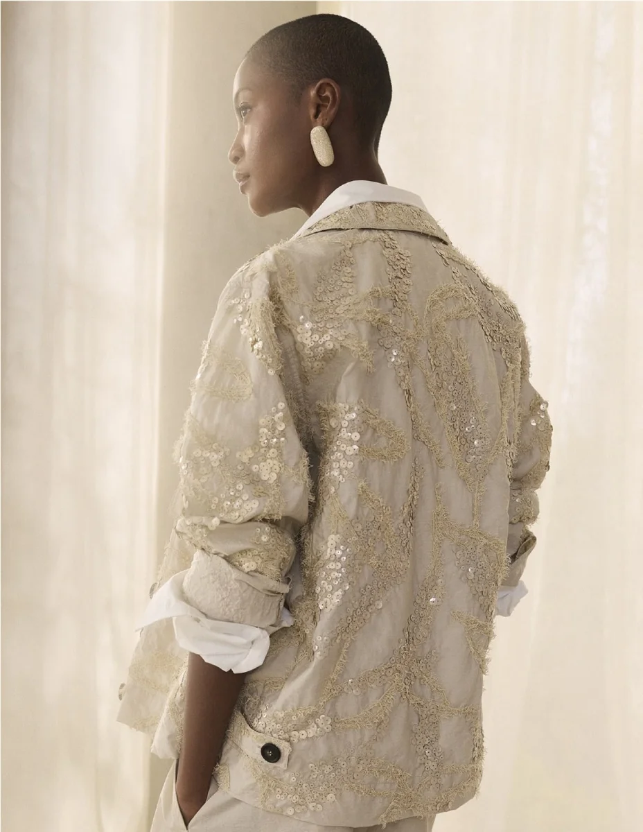Brunello Cucinelli spring/summer campaign, model against an arid tree landscape.