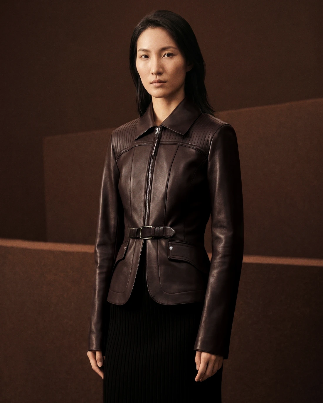 Recreated Hermès campaign image, oxblood studio environment.